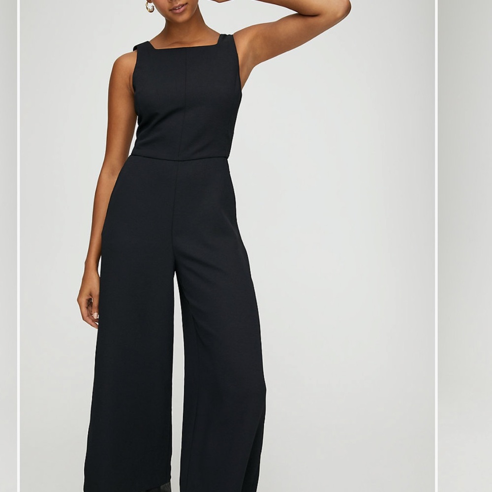 Black jumpsuit with open tie back. New with tags!